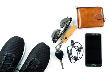 sneaker and mobile phone and travel accessories isolated on white background