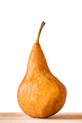 Williams or Bartlett pears on wooden table with isolated white background.