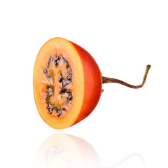 Tamarillo fruit isolated on white background with drop shadow.