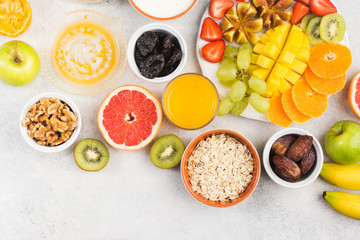 Fototapeta na wymiar Top view of healthy breakfast with oats and fruits