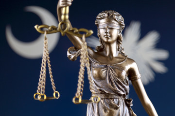 Symbol of law and justice with South Carolina State Flag. Close up.