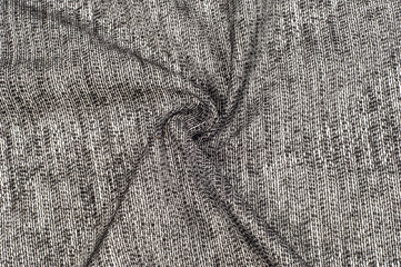fabric gray black with white inserts metallic gold Thin white yarns are drawn on a black...
