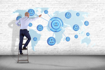 Businessman holding a Network over a connected world map - 3d render