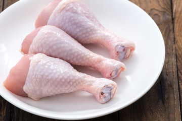 drumstick chicken on white plate

