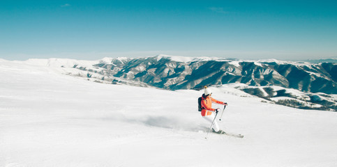 Fototapeta na wymiar Skier woman winter mountain landscape