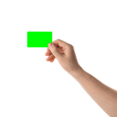 Male hand holds a two credit card or business card. Isolated with chroma key and all isolated on white background.