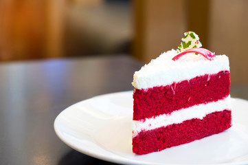 Red velvet cat on white plate , christmas theme of cake