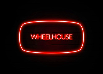 Wheelhouse neon sign on brick wall background. © 7cgart