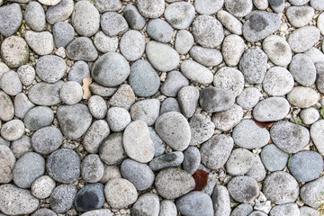 a many small stones - pebbles on the ground