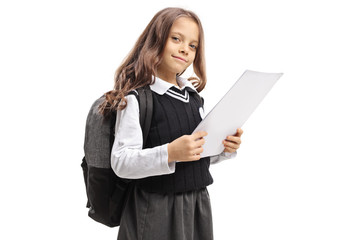 Fototapeta premium Little schoolgirl holding an exam