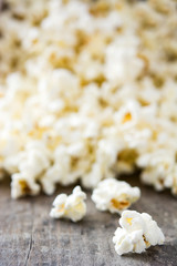 Popcorn on wooden table background. 