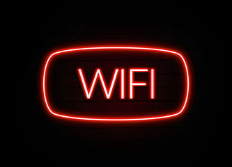 Wifi neon sign on brick wall background.