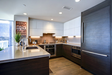 Modern spacious chef's kitchen design with white and black accents