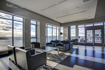 Light lounge area with view of Elliott Bay waters.