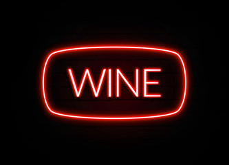 Wine neon sign on brick wall background.