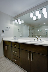 Fototapeta na wymiar Elegant bathroom with espresso double vanity