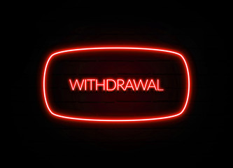 Withdrawal neon sign on brick wall background.