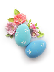 easter eggs and flowers isolated on white background