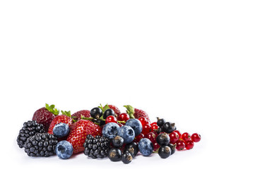 Mix berries and fruits isolated on a white. Ripe blueberries, blackberries, currants and...
