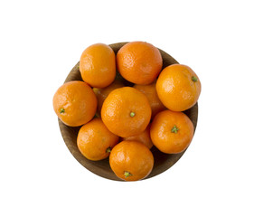 Mandarins in a wooden bowl with copy space for text. Ripe and tasty tangerines isolated on white. Clementines on a white background. Top view with copy space.