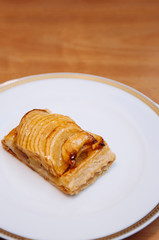 Apple pie or tart with caramelized apple cinnamon slices on top