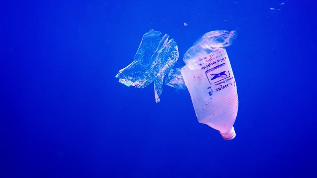 Plastic bottles and bags pollution in ocean