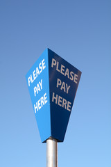 Please Pay Here sign in car park