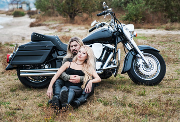 Naklejka premium Couple of bikers have relax on the beach
