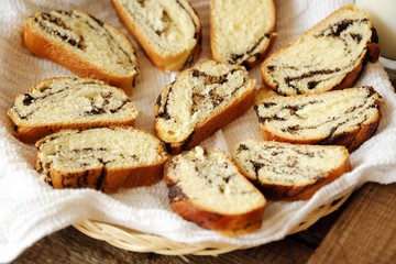 Fototapeta premium Fresh baked poppy seed roll on the table 