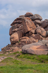 Unusual rock formation on Pink Granite Coast in Ploumanac'h site of Perros-Guirec commune in the north of Brittany in sunny spring day, France