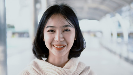Portrait Asian pretty teenager looking at  camera and smiling