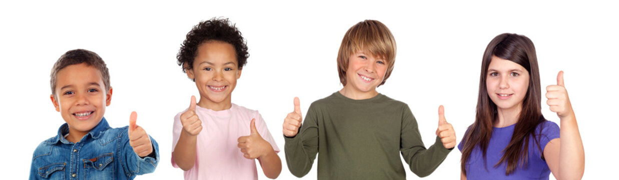 Happy children saying Ok with their thumbs