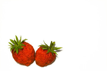 Two large strawberries isolated on a white background