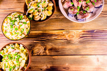 Different festive dishes on a wooden table. Top view