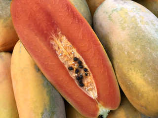 Fresh papaya fruits. Natural texture and background.