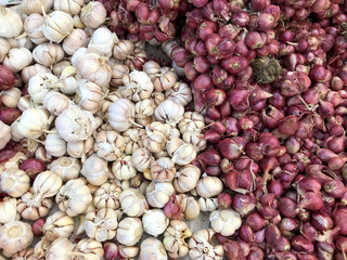 Red and white Garlic on street market in Thailand. Natural texture and background.