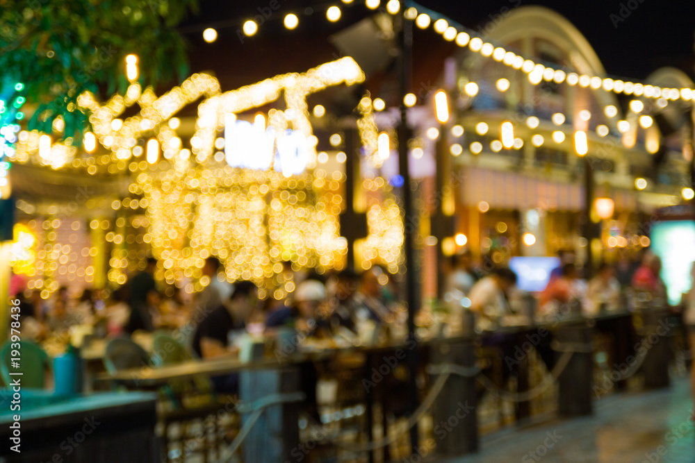 Poster abstract blur image of night festival in a restaurant and the atmosphere is happy and relaxing with 