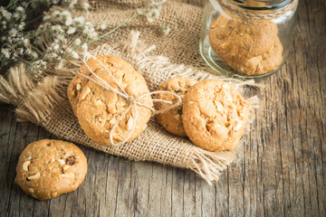 Homemade cookies on sackcloth on old wooden table