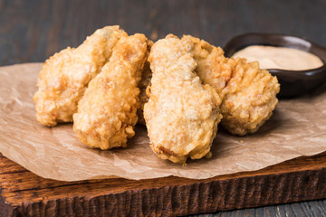 Golden brown fried chicken drumsticks