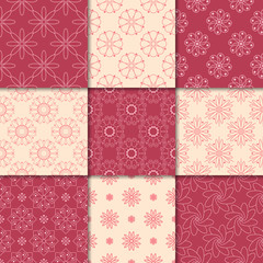 Cherry red and beige floral ornaments. Collection of seamless patterns