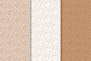 Brown floral backgrounds. Set of seamless patterns