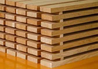 A stack of wooden brown yellow planks