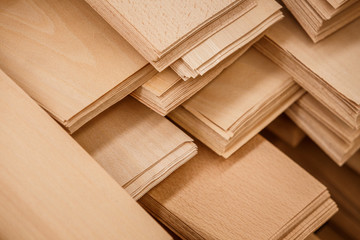 Abstract veneer sheets stacked diagonally