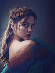 Miracle female art portrait with beautiful adult woman and traditional folk crown