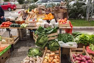 The farm food market. Vegetables, fruits and meat on the market counter.