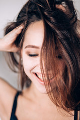 Fototapeta premium Smiling happy woman. Crazy girl on white background. Look down, wide smile, laughter
