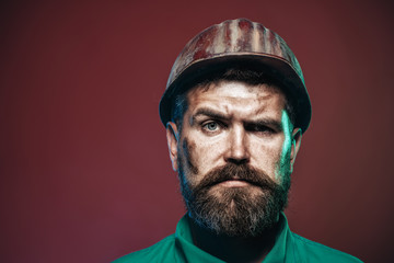 Portrait architect builder on construction site. Business, building concept - smiling builder in hard hat. Close up man in suit with construction helmet. Copy space.