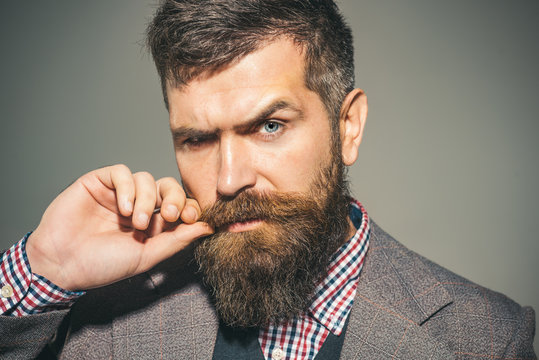 Barbershop. Fashionable bearded man. Barbershop for men. Stylish clothes.