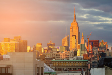 Fototapeta na wymiar Sunlight glows on the skyline of the Midtown skyscrapers of New York City