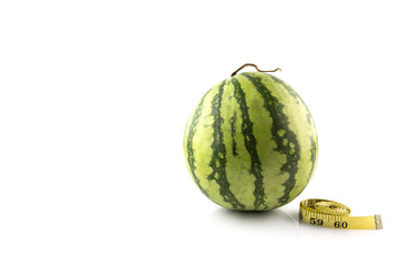 Diet concept Fresh green melon with measuring tape
